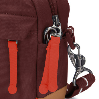 Small urban anti-theft bag Pacsafe Go - burgundy.