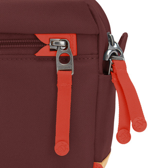 Small urban anti-theft bag Pacsafe Go - burgundy.